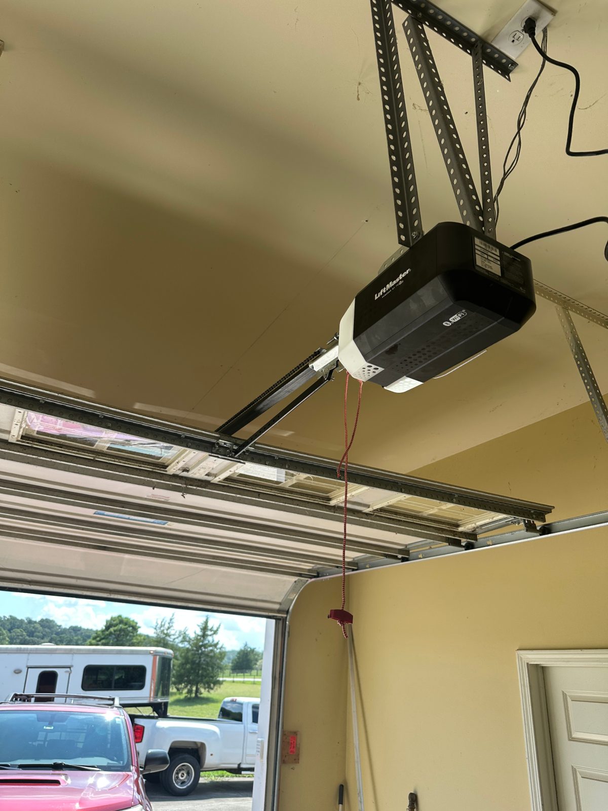 LiftMaster garage door opener mounted on the ceiling of a Marietta, GA home during an opener noise service call