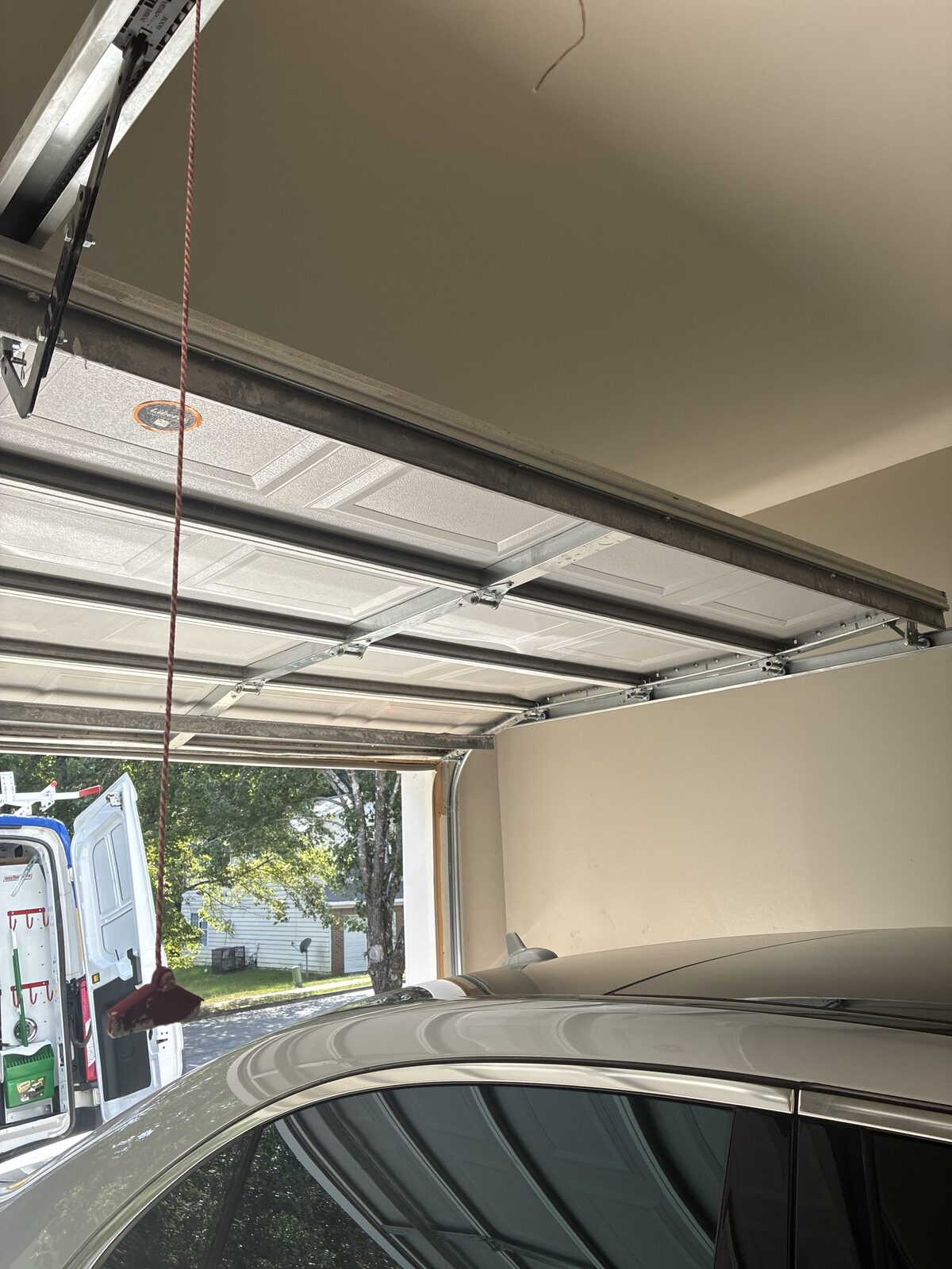 Fully repaired garage door open and operating smoothly on its track after service in Decatur, Georgia