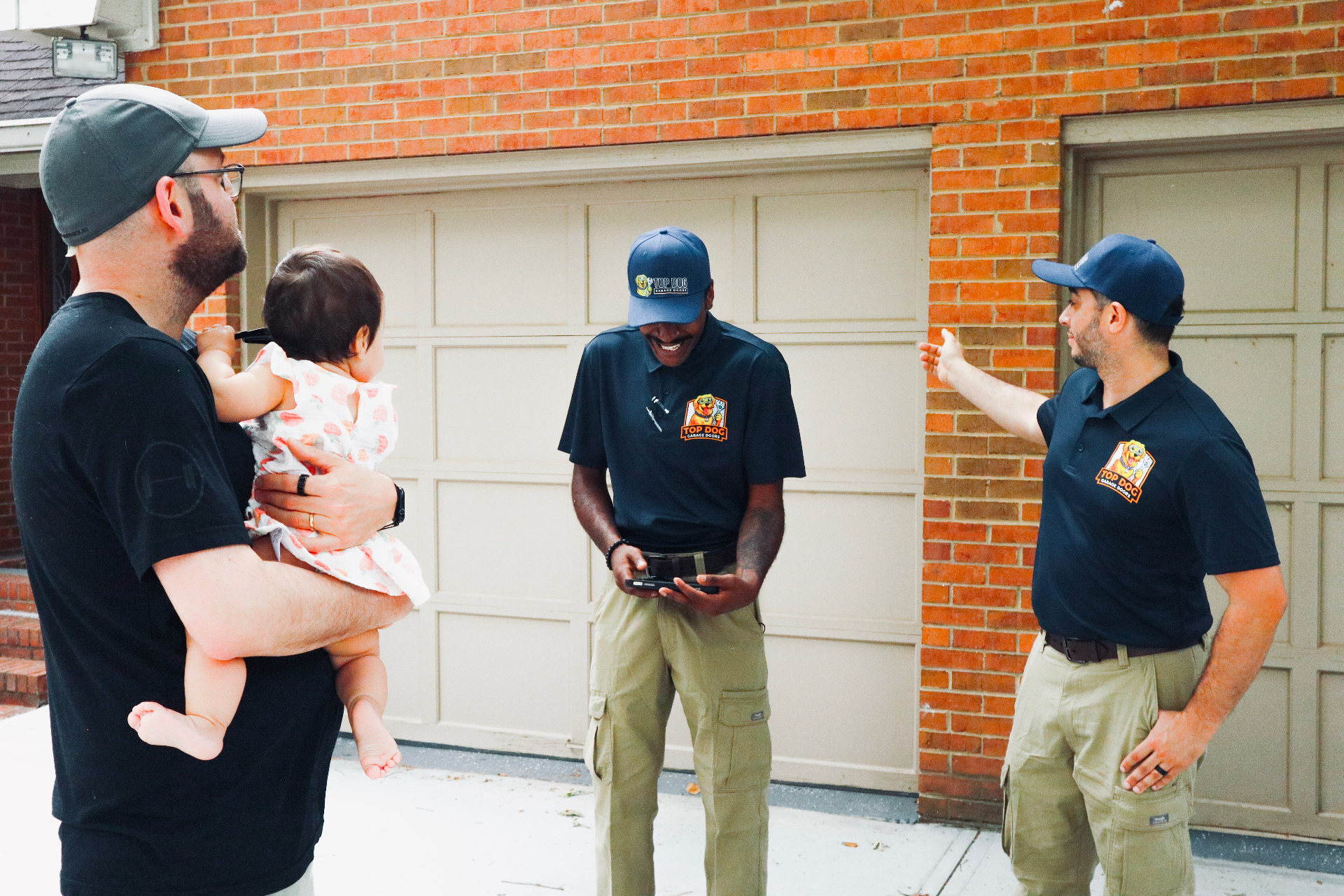 Top Dog Garage Doors team meeting with a happy customer in Decatur, GA